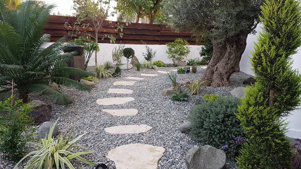 Beautiful Mediterranean garden with colorful flowers and well-maintained landscaping