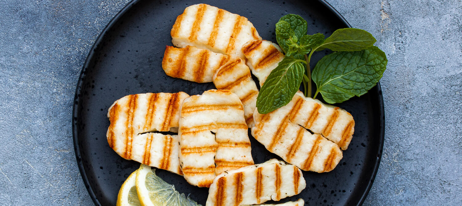 Grilled Halloumi cheese with mint garnish