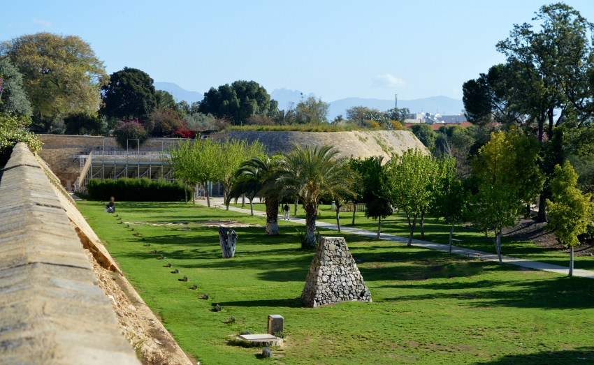 The green moat and Venetian walls of Nicosia old town with the Pentadaktylos mountain range in the distance